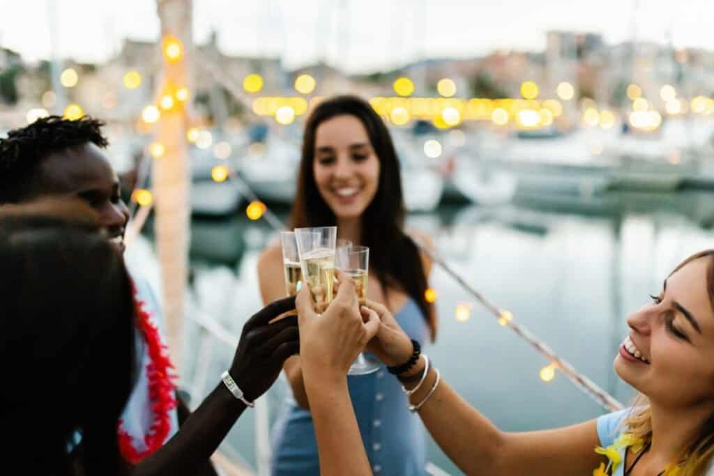 A toast after a wine tasting on board. Concept of friendship and celebration. Focus on the glasses  